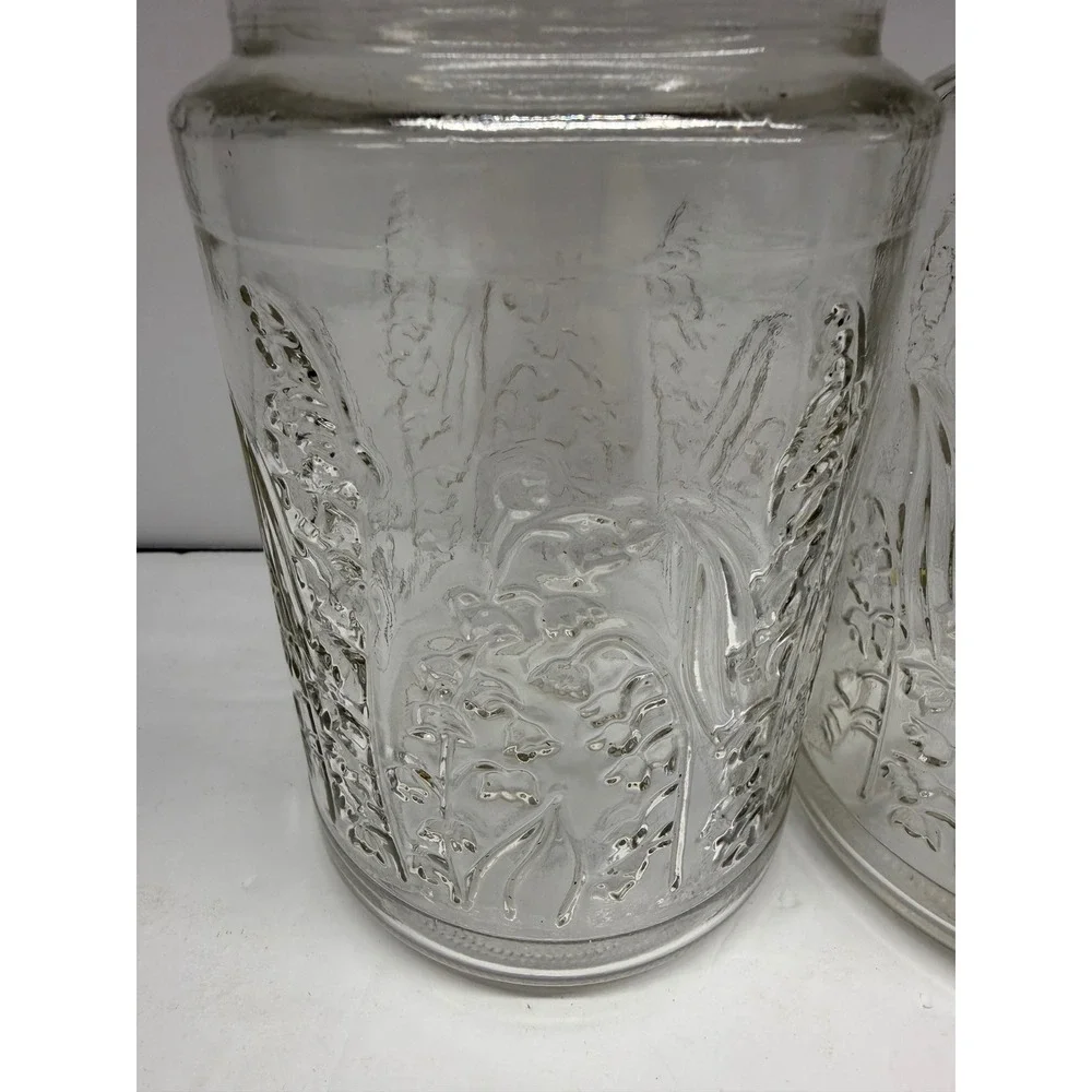 Vintage Lilies of the Valley Clear Glass Jars Embossed Floral Canisters Set of 2